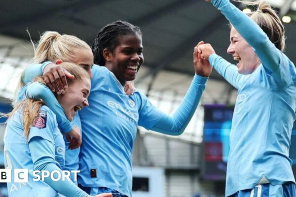 Manchester City celebrate scoring a goal last season
