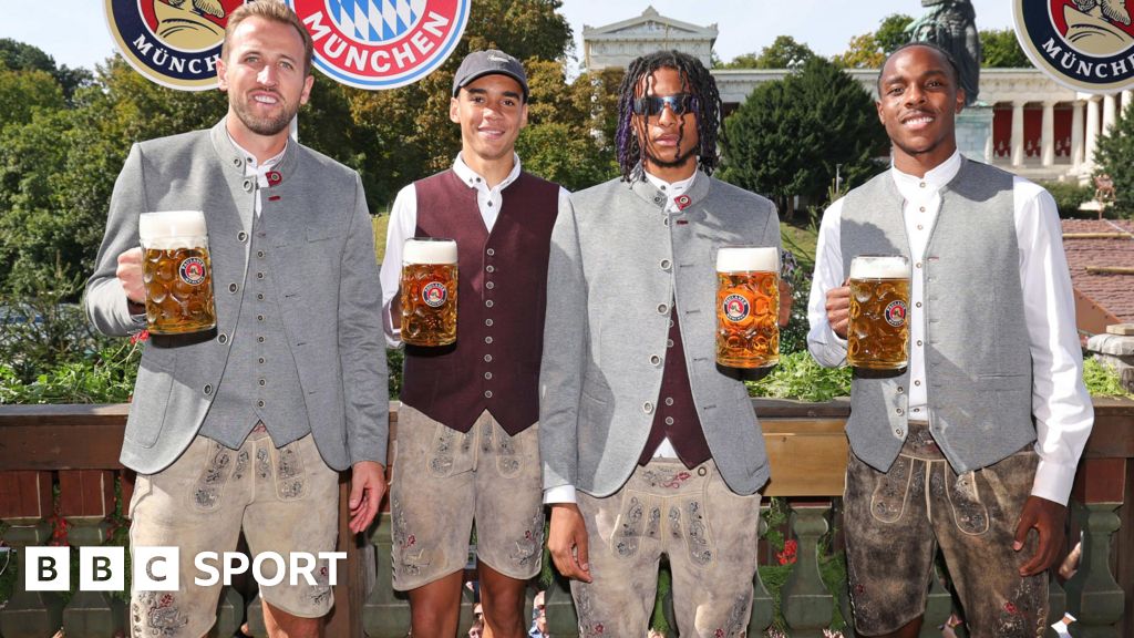 Harry Kane, Jamal Musiala, Michael Olise and Mathys Tel hold up beers at Oktoberfest