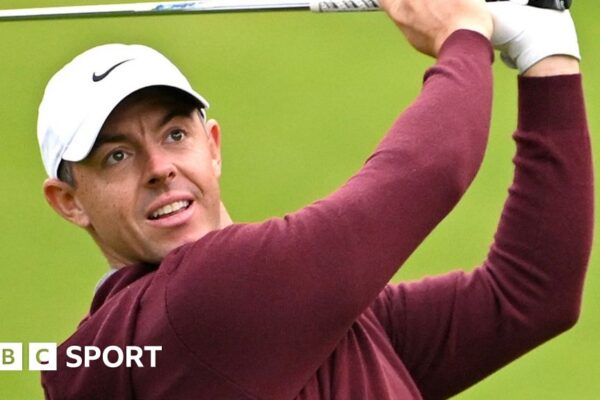 Rory McIlroy in a cream jumper