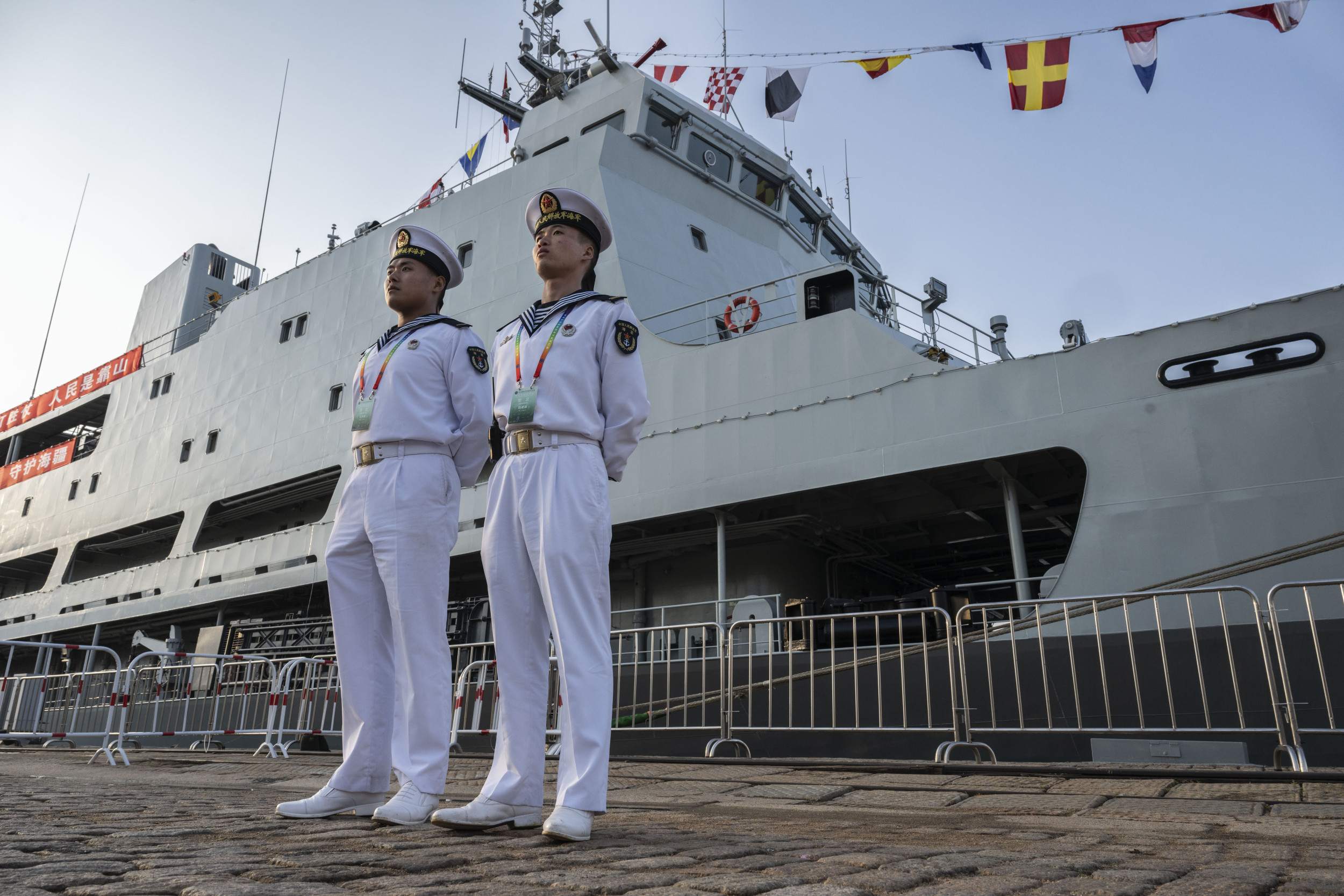 Chinese Sailors Stand Next to Navy Ship