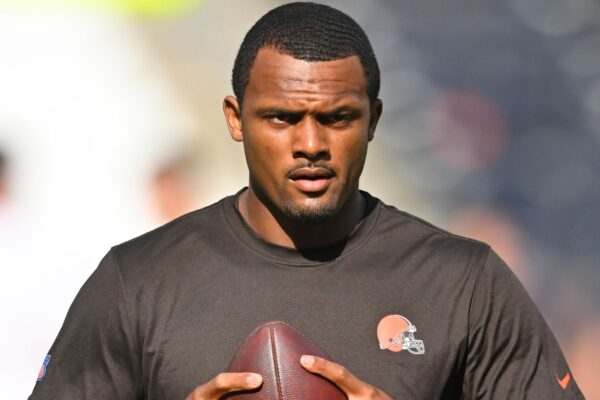 FILE - Cleveland Browns quarterback Deshaun Watson stands on the field before an NFL preseason football game against the Chicago Bears, on Aug. 27, 2022, in Cleveland. Watson can begin practicing on Monday, Nov. 14, 2022,  as part of his agreement with the NFL on an 11-game suspension after being accused of sexual misconduct by two dozen women when he played for Houston. (AP Photo/David Richard, File)