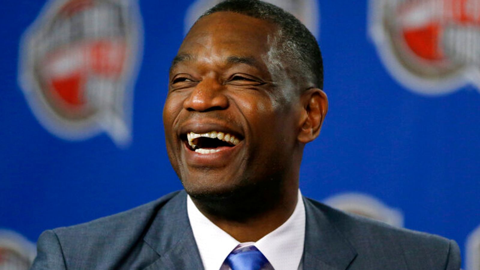 FILE - Former NBA basketball player Dikembe Mutombo laughs during a news conference announcing him as one of the 12 finalists of this year's hall of fame class during an event ahead of the NBA All Star basketball game, on Feb. 14, 2015, in New York. Mutombo is undergoing treatment in Atlanta for a brain tumor, the NBA announced Saturday, OCt. 15, 2022, (AP Photo/Julio Cortez)