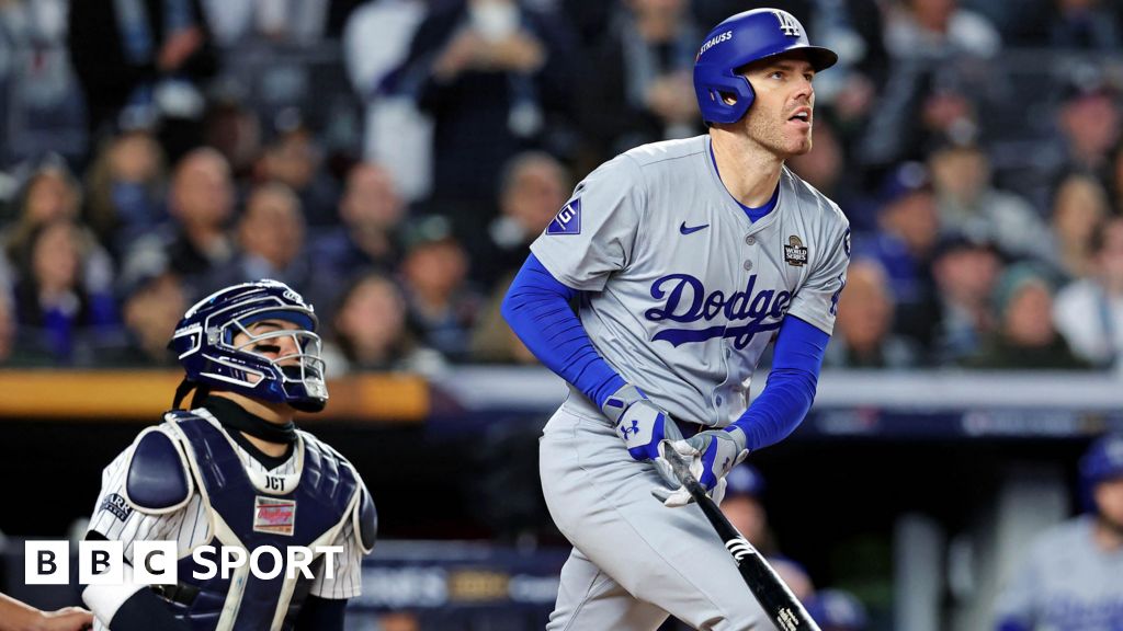 Los Angeles Dodgers first baseman Freddie Freeman hits a home run in the first inning of game three of the World Series