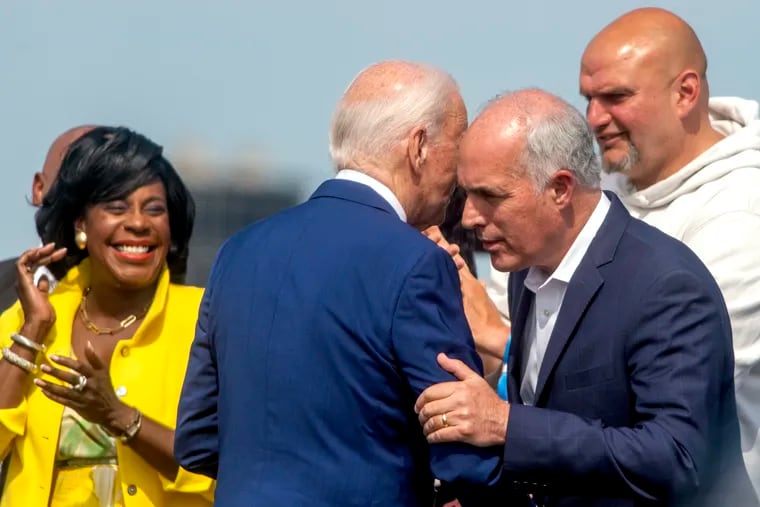 President Joe Biden was greeted by (from left) Mayor Cherelle L. Parker, and U.S. Sens. Bob Casey and John Fetterman as he arrived on Marine One at Philadelphia International Airport Sunday, July 7, 2024. Biden announced his withdrawal from the presidential race later that month.