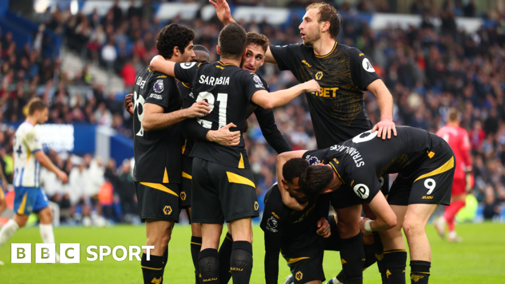 Wolves' players celebrate scoring against Brighton