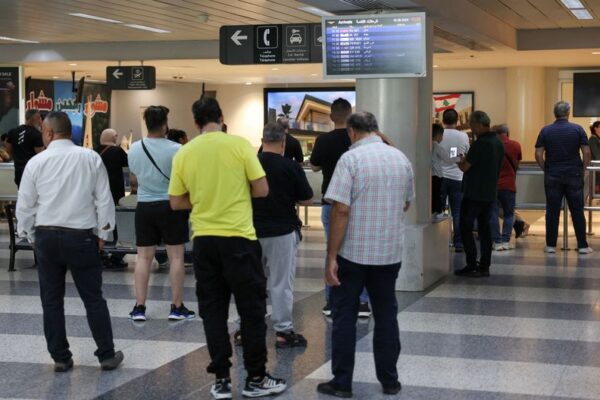 FILE PHOTO: People stand at Beirut-Rafic Hariri International Airport, in Beirut