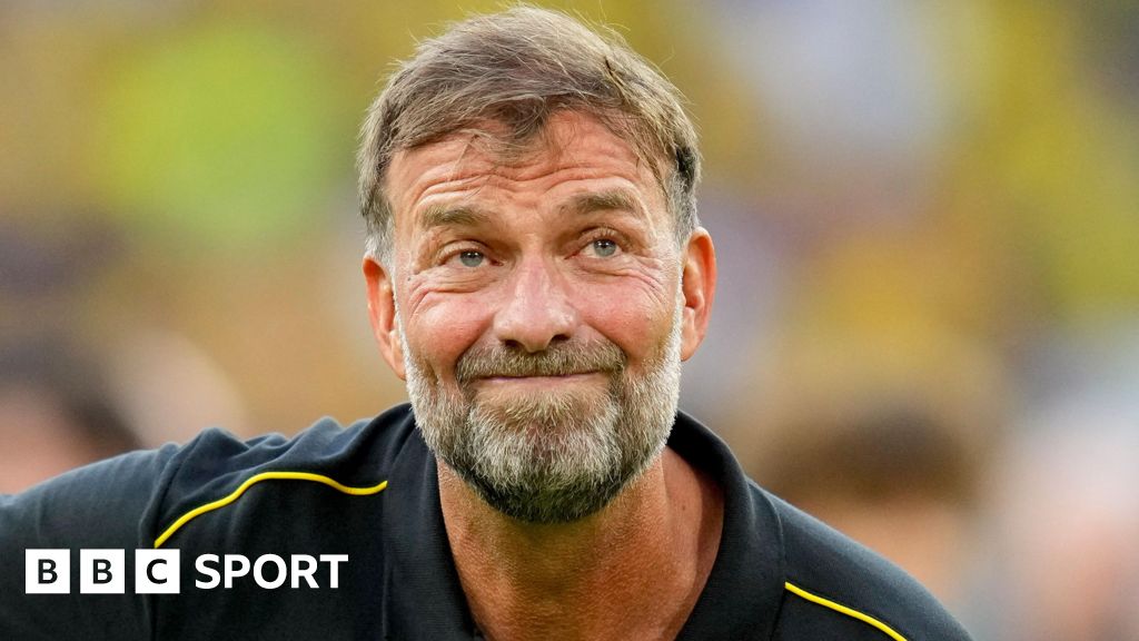 Jurgen Klopp stifles a smile during a Borussia Dortmund farewell match for Lukasz Piszczek and Jakub Blaszczykowski