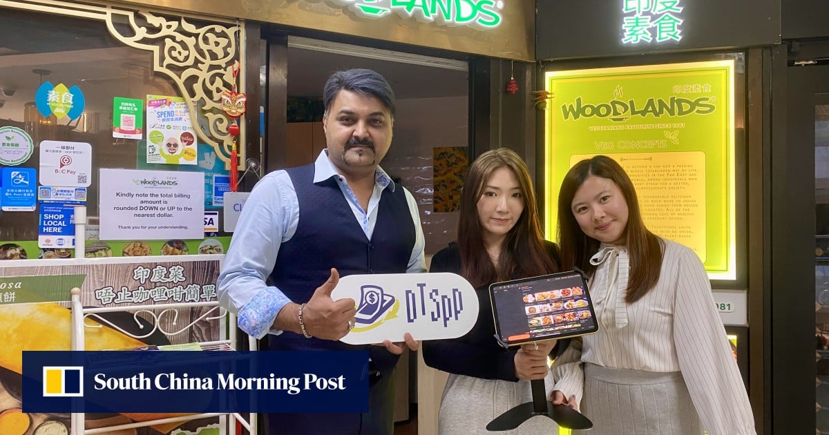 Alex P.E, Chairman of WOODLANDS Group of Restaurants in Hong Kong and Macau (left) is joined by Suki Shiu (centre) and Crystal Ngai (right) from Roka Service as they showcase the POS system adopted by the restaurant.