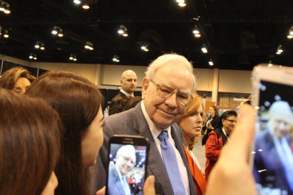 Fans of Warren Buffett taking his photo