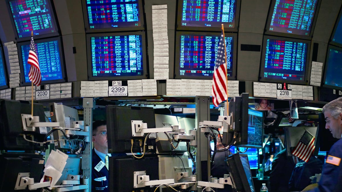 The Dow spikes 300 points on Fed minutes, inflation report