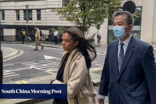 Manager of Hong Kong trade office in London returns to court over spying charges