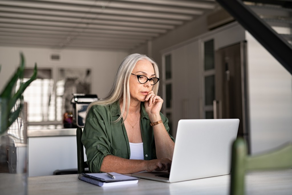 A single woman works on her retirement plan.