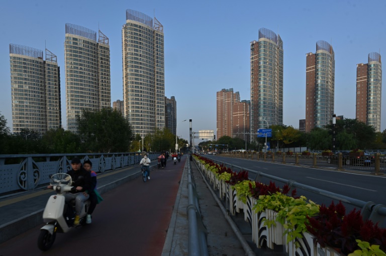 China unveiled stimulus measures to boost an economy blighted by a years-long property sector crisis and chronically low consumption (ADEK BERRY)