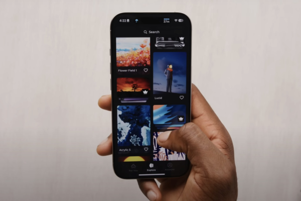 An image showing Marques Brownlee holding up a phone with the Panels app open