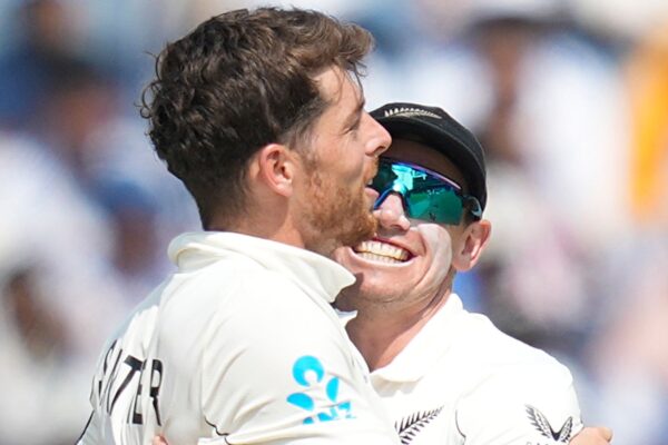New Zealand's Mitchell Santner (left) and captain Tom Latham (right) celebrate the Test series win over India (Associated Press)
