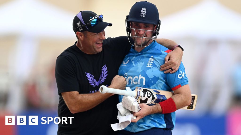 Liam Livingstone is congratulated by England coach Marcus Trescothick