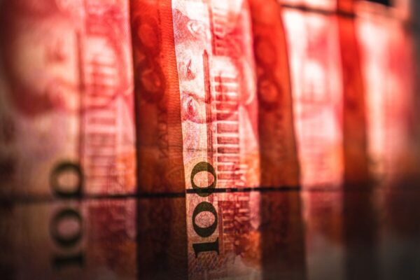 Chinese Yuan Slides, Stock Futures Whipsaw After Debt Swap Plan