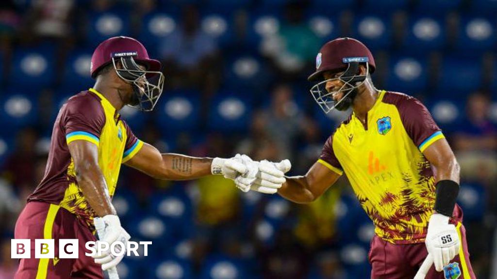 Evin Lewis and Shai Hope bump fists during their partnership of 136 v England