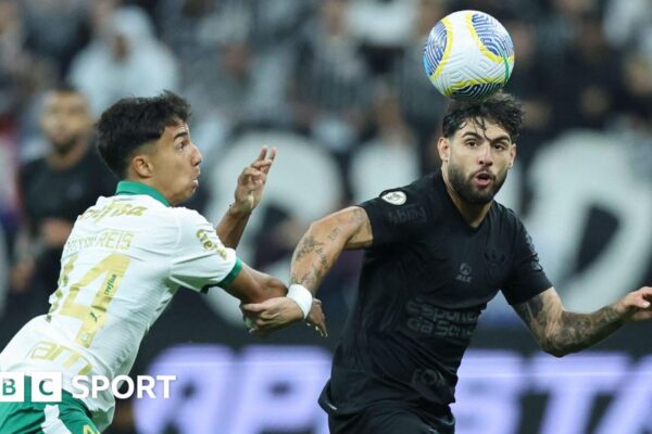 Corinthians forward Yuri Alberto (right) tussles with an opposition player