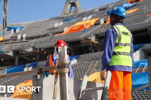 Construction workers at the Lusail Stadium in Doha in 2019 ahead of the 2022 World Cup