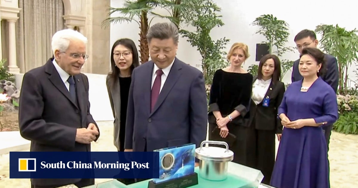 Chinese leader Xi Jinping gives moon dust to visiting Italian President Sergio Mattarella