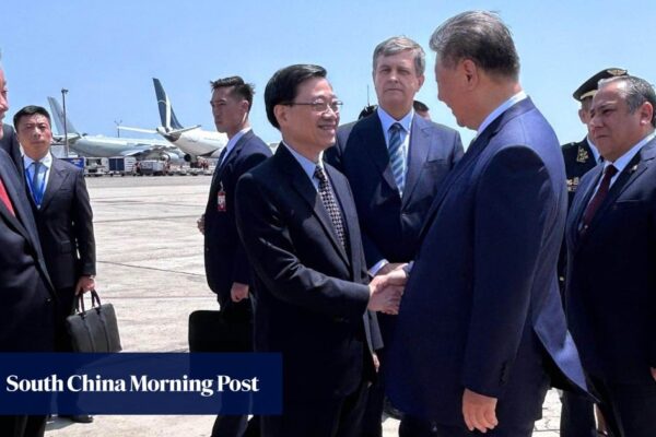 Hong Kong leader John Lee greets Chinese President Xi Jinping in Peru ahead of Apec summit