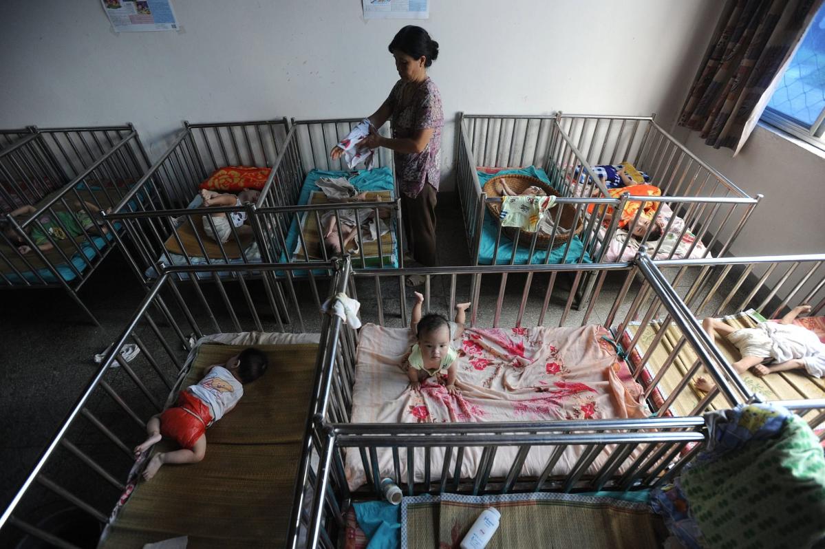 US lawmakers urge Biden to help families after Beijing ends scheme