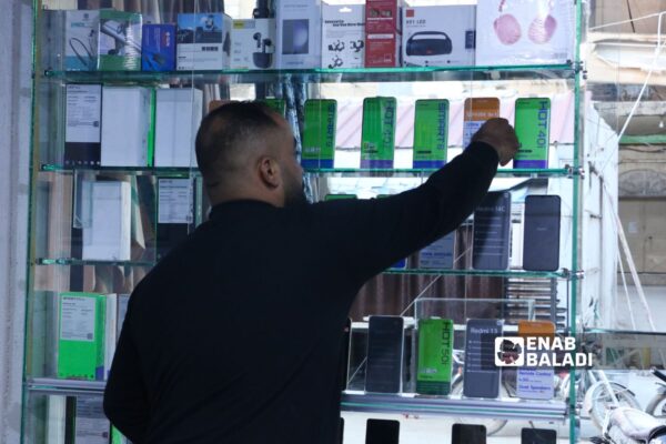 Smart device users in Ras al-Ain are turning to low-priced Chinese phones due to the difficult economic and living conditions - November 6, 2024 (Enab Baladi)