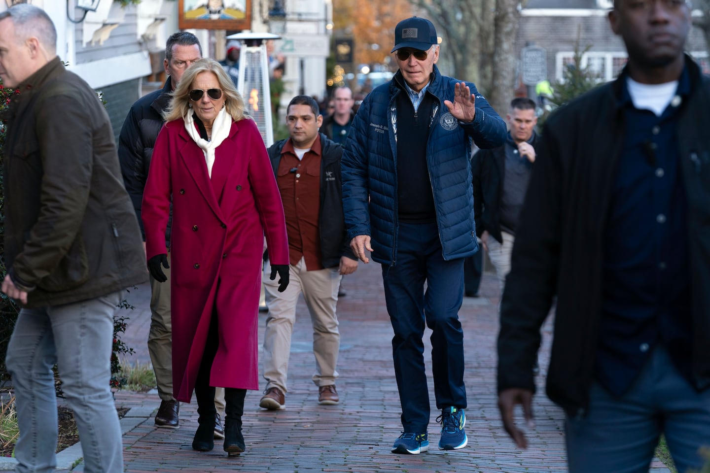 President Joe Biden, right, and first lady Jill Biden walk in downtown Nantucket on Friday.