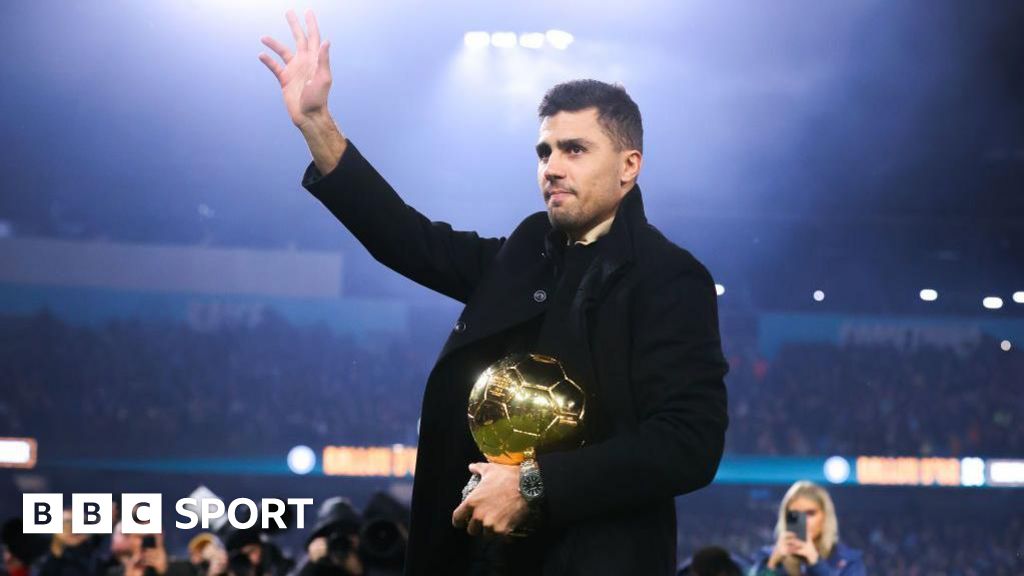 Rodri with the Ballon d'Or trophy