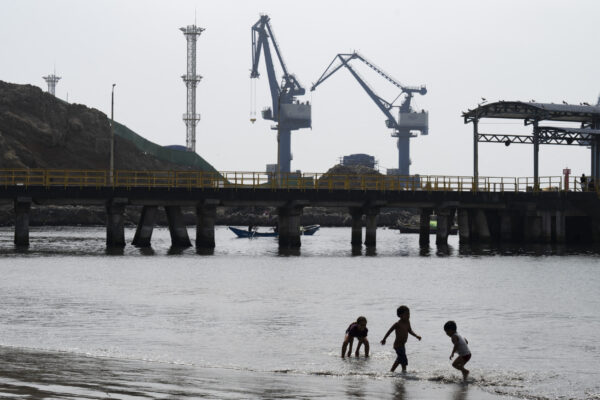 Children Play in Shadow of Chancay port