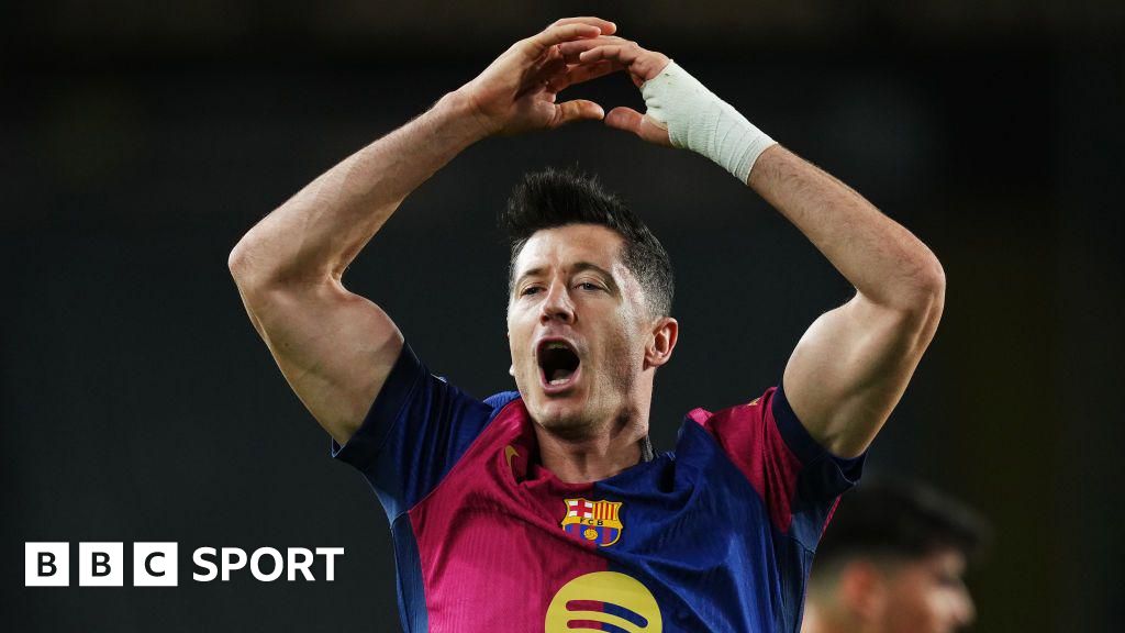 Robert Lewandowski celebrates scoring for Barcelona against Brest