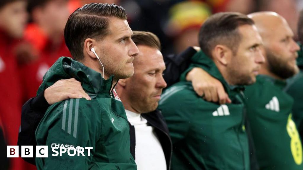 Piet Cremers, Craig Bellamy, Andrew Crofts and James Rowberry line up for the Welsh anthem