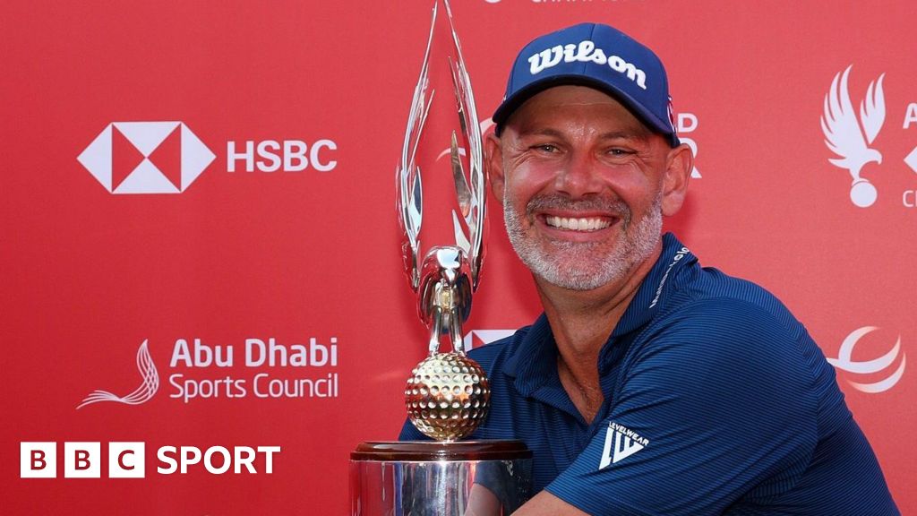 Paul Waring hugs the Abu Dhabi Championship trophy