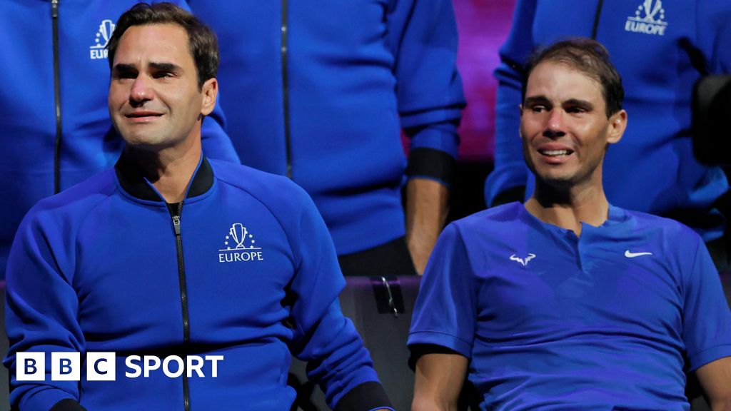 Roger Federer and Rafael Nadal cry, sat alongside each other