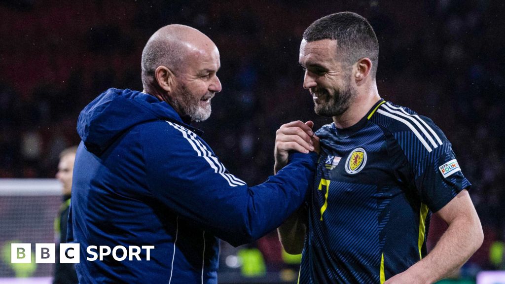 Steve Clarke celebrates with John McGinn after Scotland's win against Croatia