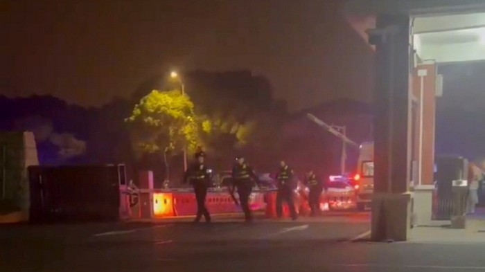 Police respond outside the vocational college in China