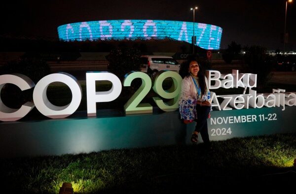 Trump and Germany loom over uncertain COP29 finance talks A woman poses for a photo in front of the logo at the COP29 summit in Baku, Azerbaijan