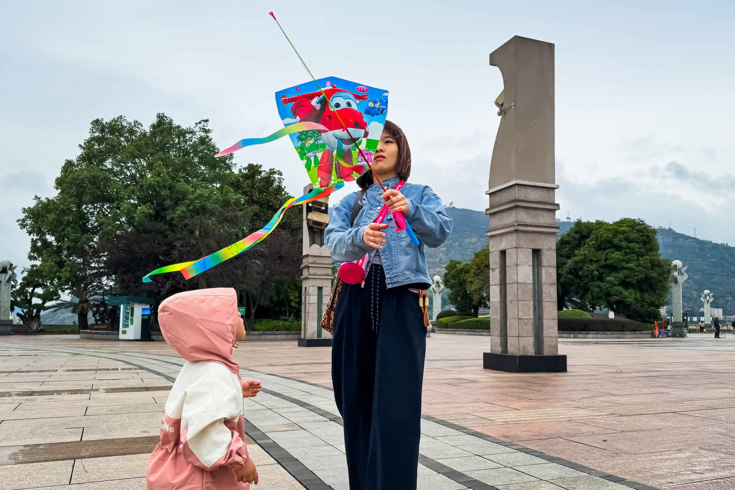 Mother and Daughter Fly Kite in Chongqing