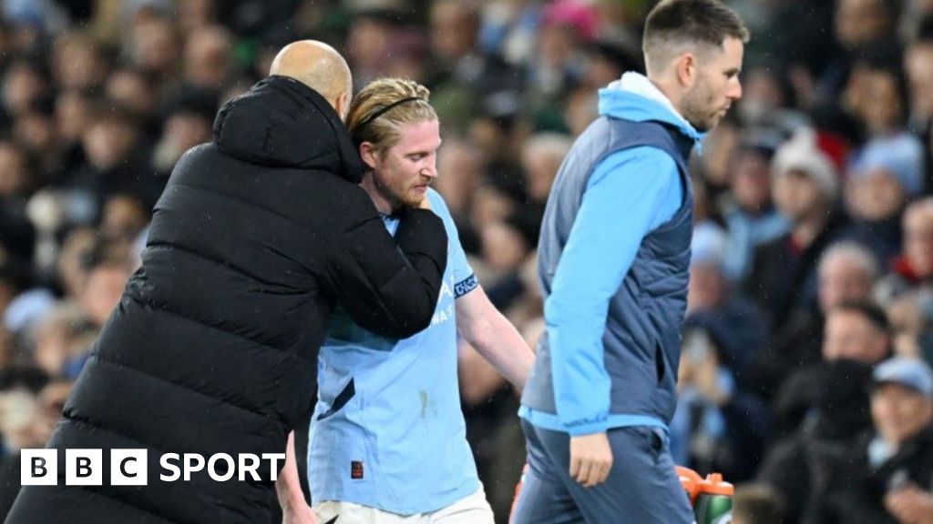 Manchester City's Kevin de Bruyne is hugged by manager Pep Guardiola after being substituted during the 3-0 win against Nottingham Forest