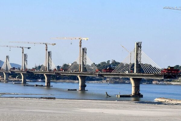 Construction is in swing of the six-lane high-tech extradosed bridge over the river Brahmaputra, connecting Guwahati and North Guwahati. (ANI Photo)