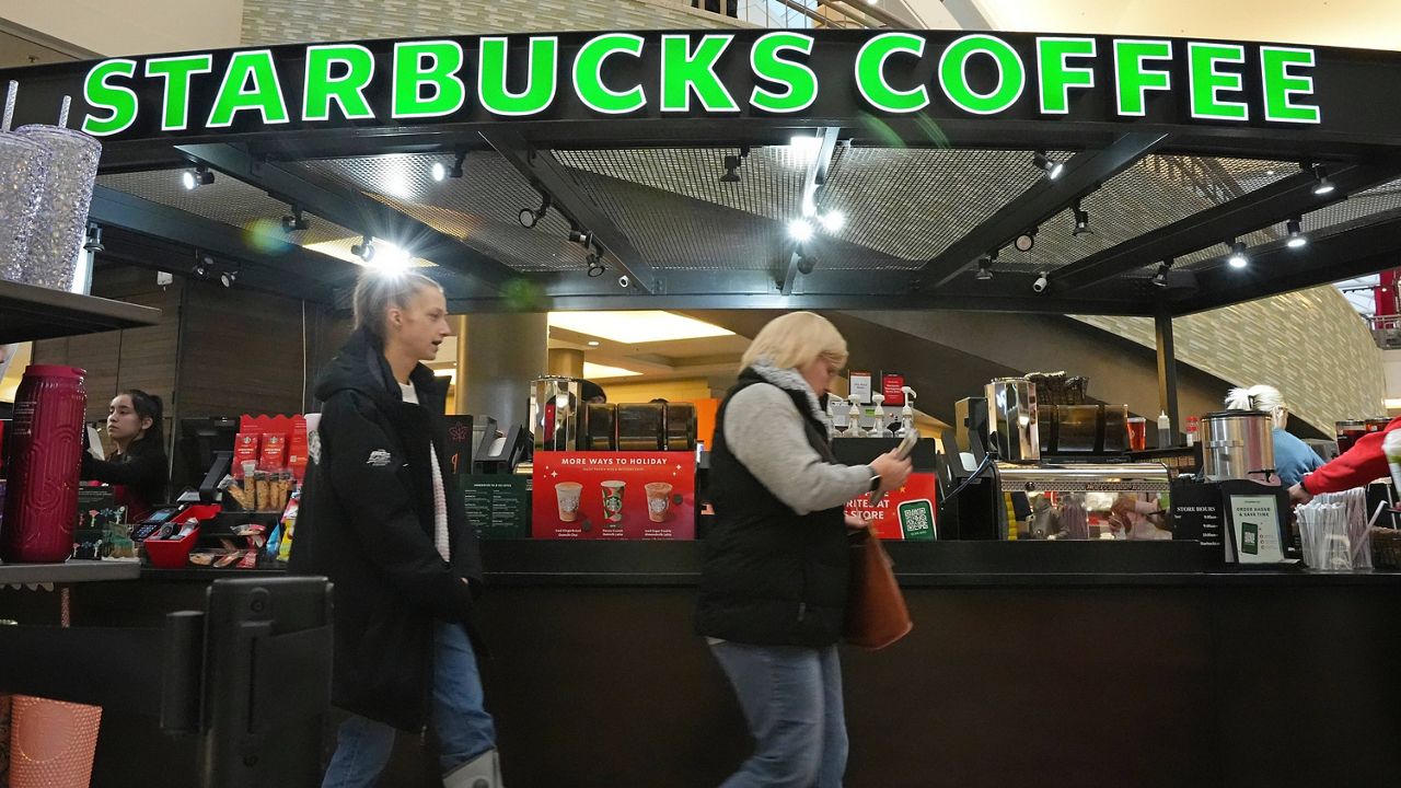 Shoppers at the Walden Galleria in Buffalo, NY, stop by the Starbucks kiosk on Nov. 30, 2024. (AP Photo/Gene J. Puskar, File)