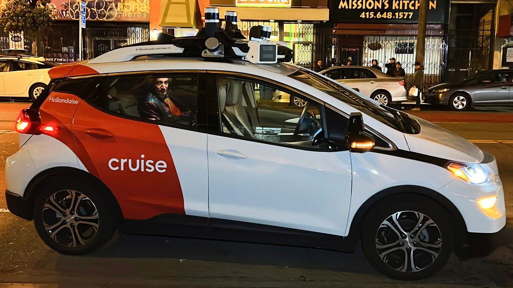 Associated Press reporter Michael Liedtke sits in the back of a Cruise driverless taxi that picked him up in San Francisco's Mission District, Feb. 15, 2023. (AP Photo/Terry Chea, File)