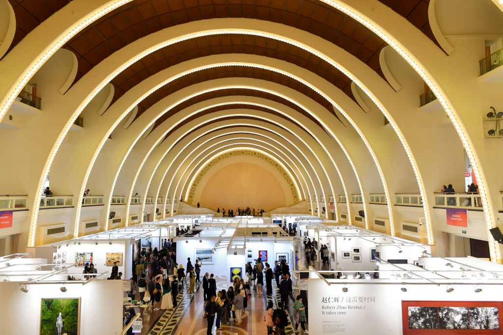 SHANGHAI, CHINA - APRIL 25:Visitors view The 9th Photofairs Shanghai at Shanghai Exhibition Centre on April 25, 2024 in Shanghai, China.(Photo by Zhe Ji/Getty Images)