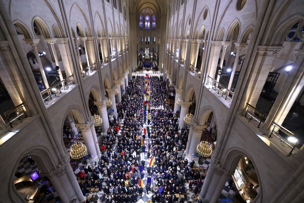 Photos from Notre Dame Cathedral hosts first mass since devastating 2019 fire