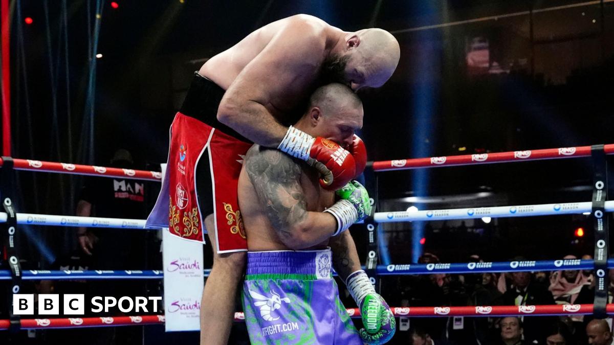 Tyson Fury enters the ring dressed as santa