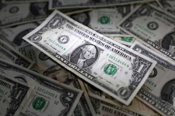 Dollar holds steady despite rate cut bets; Aussie rises after jobs data