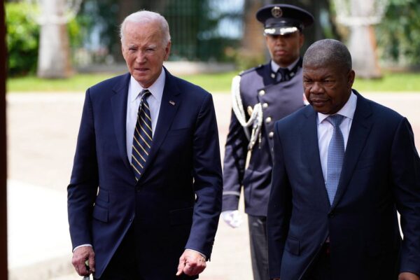 President Joe Biden inspects the honor guard with Angola's President Joao Lourenco at the presidential palace in Luanda, Angola, on Tuesday, Dec. 3, 2024. (AP Photo/Ben Curtis)