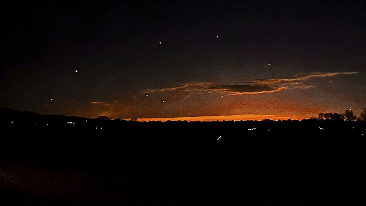 This photo provided by Trisha Bushey shows the evening sky and points of light near in Lebanon Township, N.J., on Thursday, Dec. 5, 2024. (Trisha Bushey via AP)