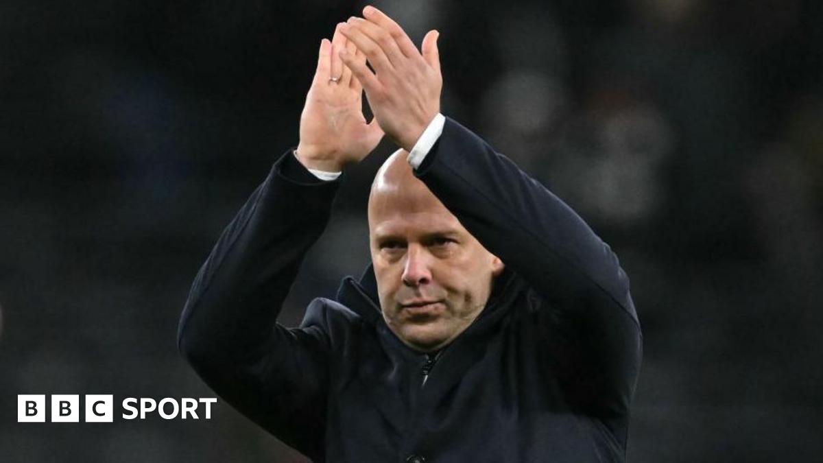 Liverpool Head Coach Arne Slot acknowledges the fans at the end of the emphatic victory at Spurs